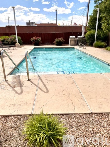 A pool with a ladder in the middle of it.