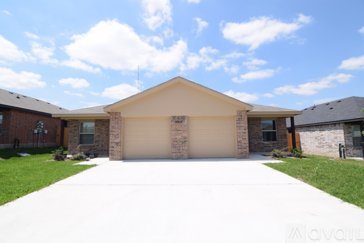 A house with a garage is for sale.