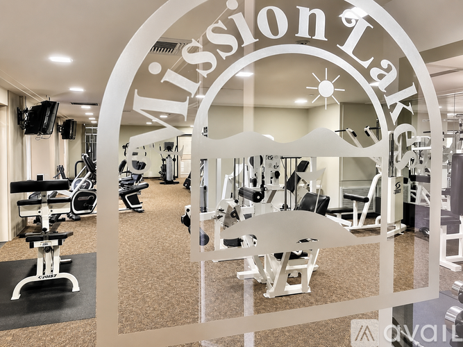 A gym with a sign that says Mission Fitness.