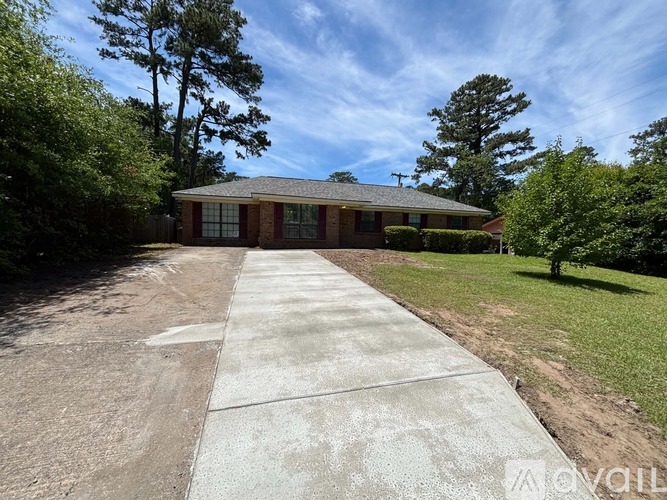 A house with a driveway in front of it.
