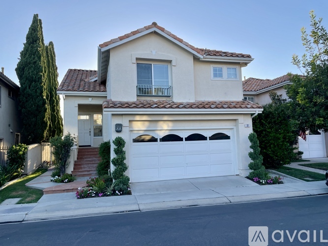 A house with a white garage door is for sale.