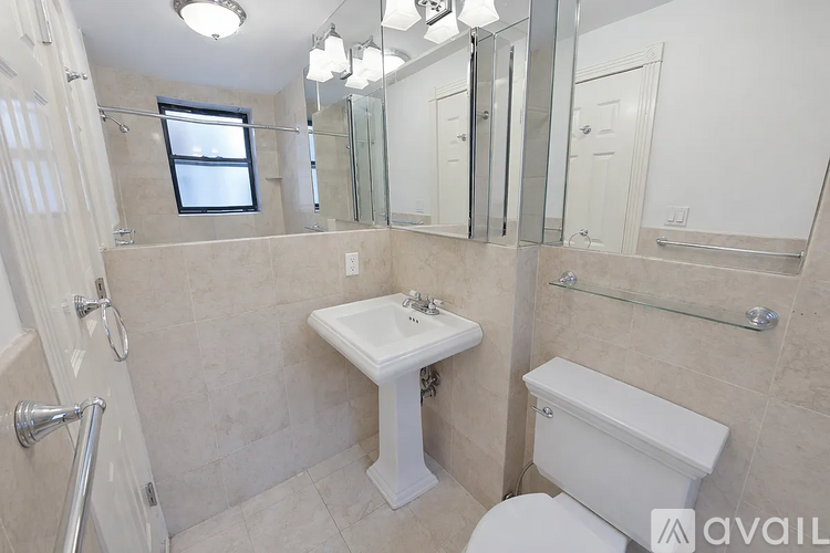 A bathroom with a sink, toilet, and bathtub.
