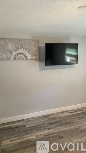 A wall with a flat screen TV mounted on it.