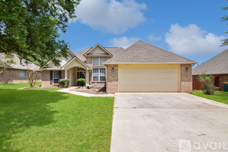A house with a garage is available for sale.
