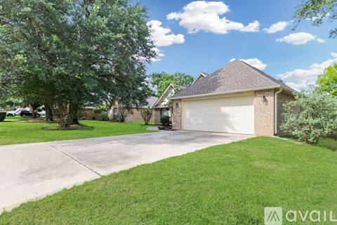 A house with a garage door is for sale.