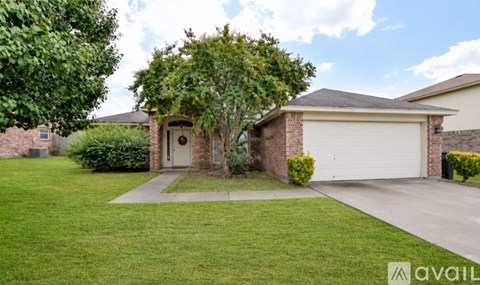 A house with a tree in front of it.