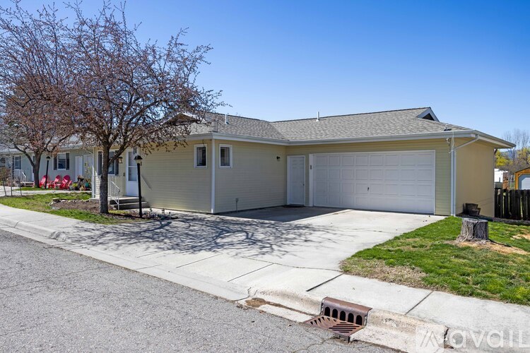 A house with a garage is for sale.