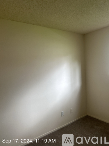 A room with a light switch and a date stamp on the bottom.