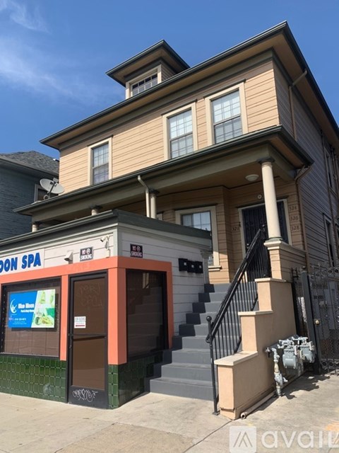 A two-story building with a spa on the ground floor.