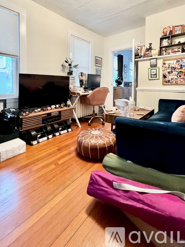 A living room with a fireplace and a couch.