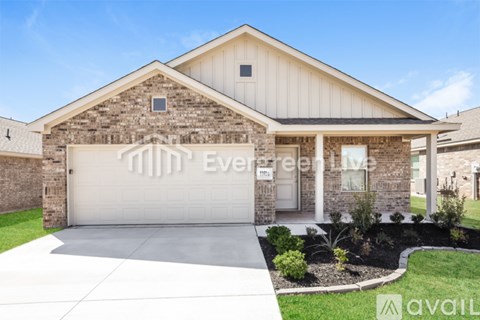 A house with a garage door that says "Evergreen".