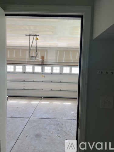 A room with a window and a door.