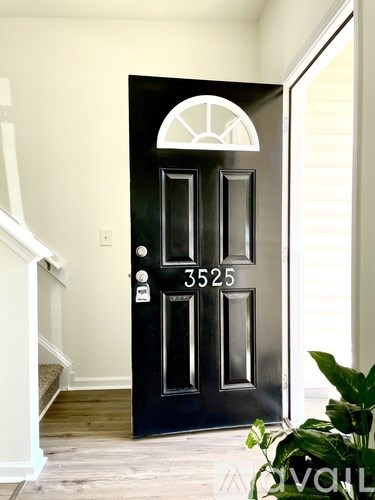A black door with the number 3525 on it.