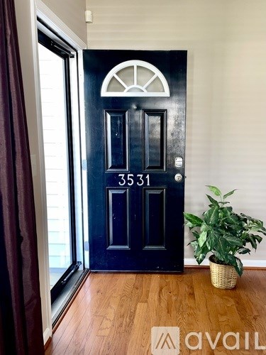 A black door with the number 3531 on it.