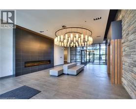 A modern interior space with a stone wall and a fireplace.