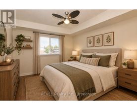A bedroom with a large bed, a ceiling fan, and a window with curtains.