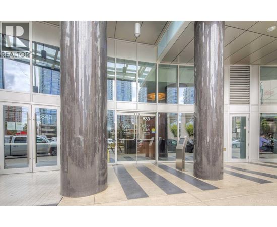 A realtor office with a glass door and a sign on it.