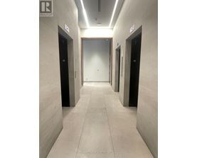 A hallway with elevator doors numbered 10, 2, and 6.