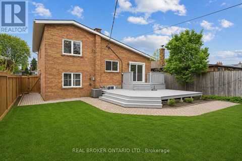 A house with a red brick exterior and a white door is for sale.