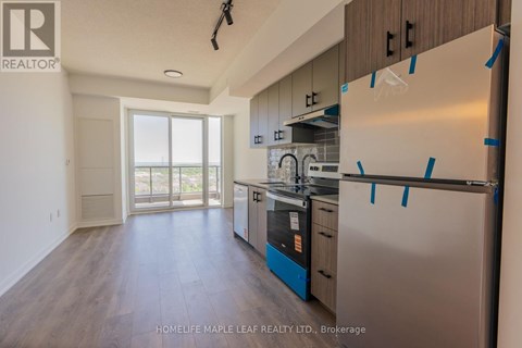 A kitchen with a refrigerator, oven, and dishwasher is for sale.