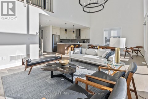 A modern living room with a large coffee table and comfortable seating.