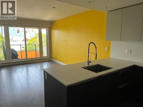 A kitchen with a sink and cabinets.