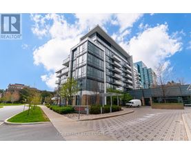 A modern building with a glass facade is the main focus of the image.