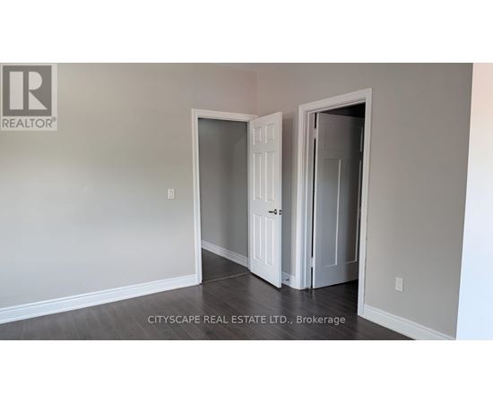 A room with a doorway leading to another room.