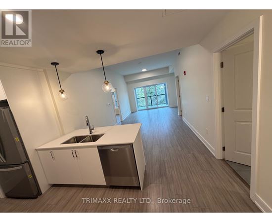 A kitchen with a sink and a window.