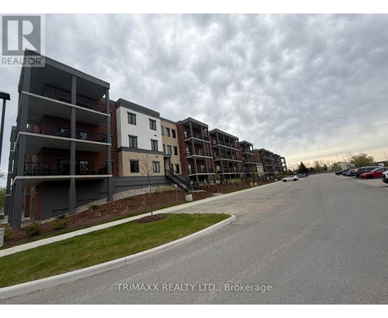 A row of modern apartment buildings with a cloudy sky in the background.