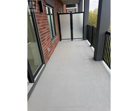 A glass door is closed with a black frame.