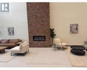 A living room with a fireplace and a couch.