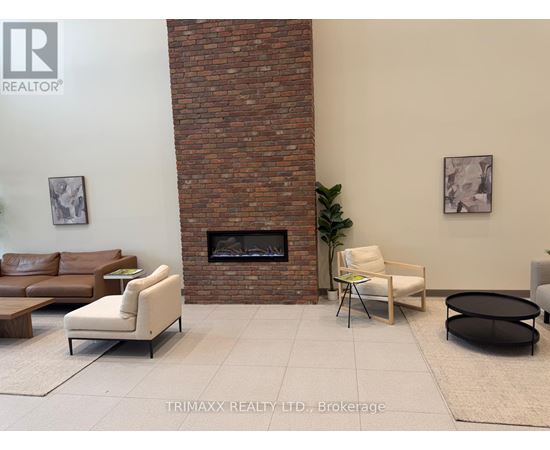 A living room with a fireplace and a couch.
