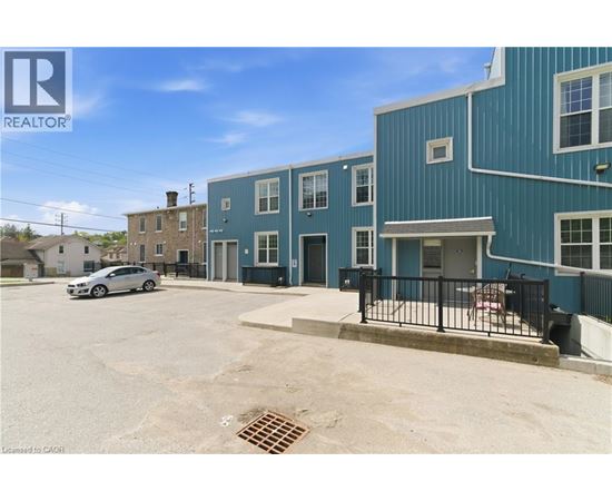 A blue building with a car parked in front of it.