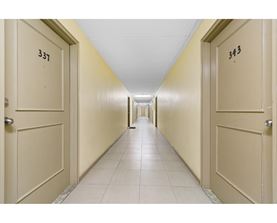 A long hallway with doors numbered 337 and 343.