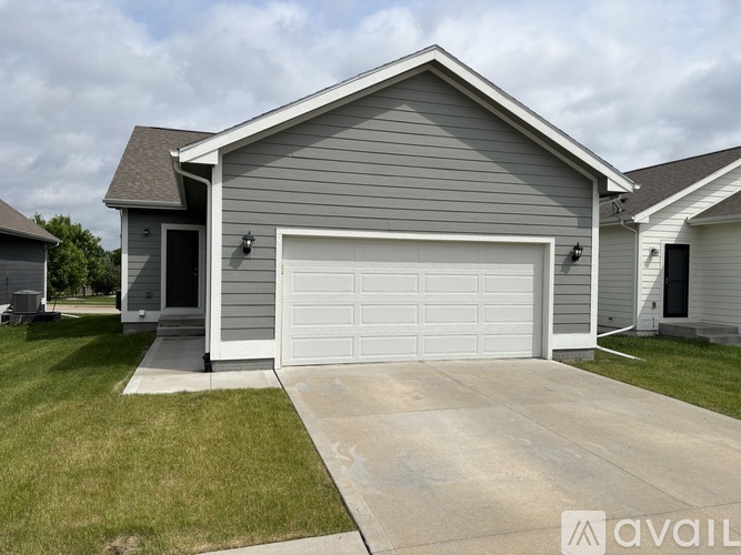 A house with a garage is available for sale.