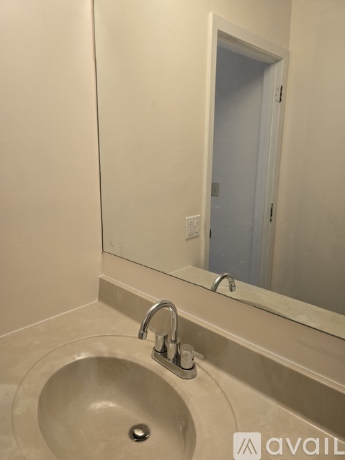 A bathroom sink with a mirror above it.