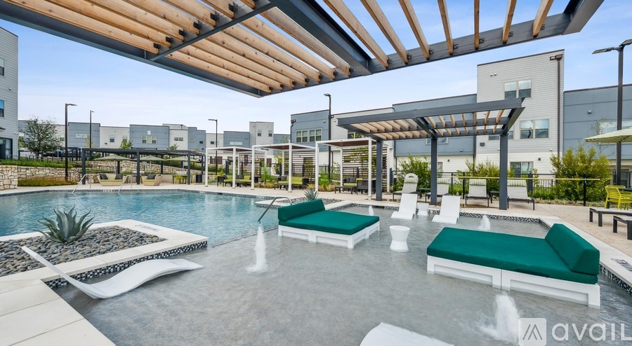 A modern outdoor pool area with a wooden pergola and lounge chairs.