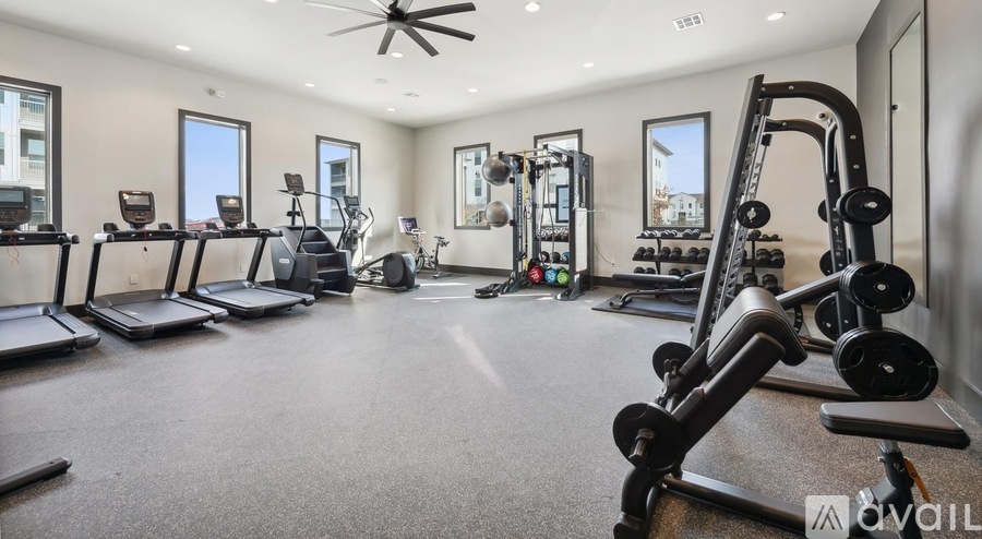 A well-equipped home gym with a variety of exercise equipment.