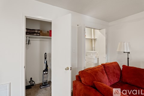 A bedroom with a bed, dresser, and window.
