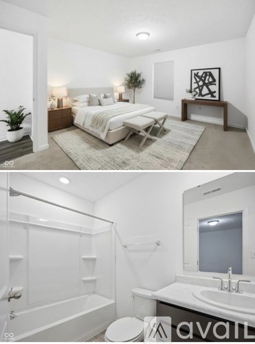 A bedroom with a bed and a bathroom with a tub and sink.