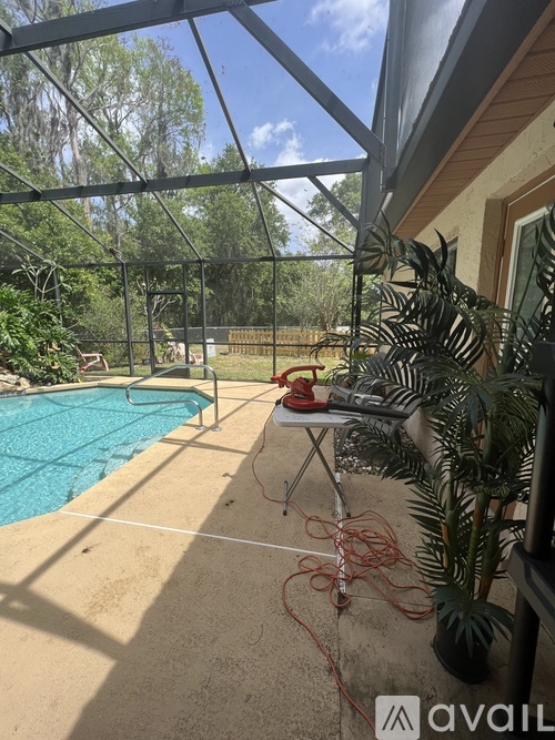A pool with a red rope around it.