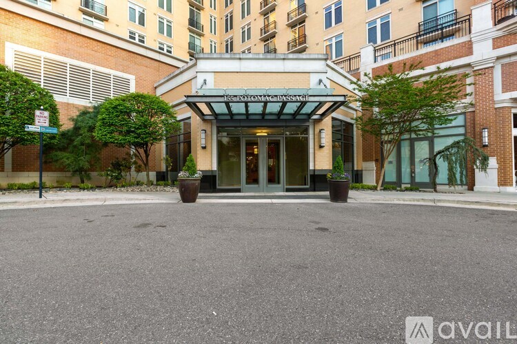 The entrance to a building with a glass door and a sign above it.
