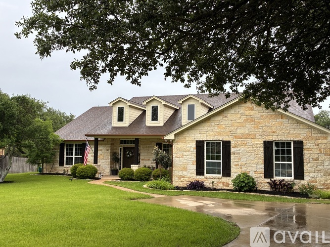 A house with a flag on the front porch.
