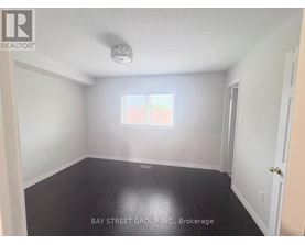 A room with a window and a door is for sale.