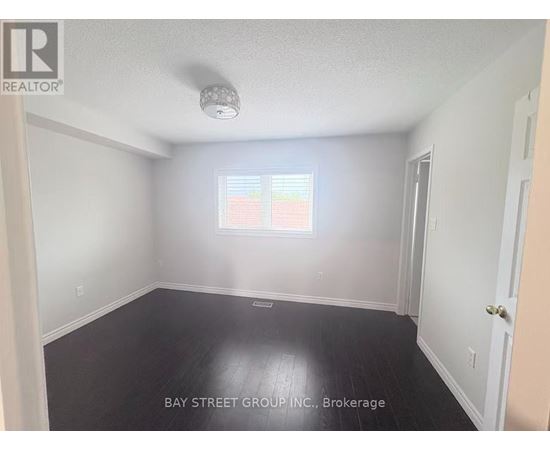 A room with a window and a door is for sale.