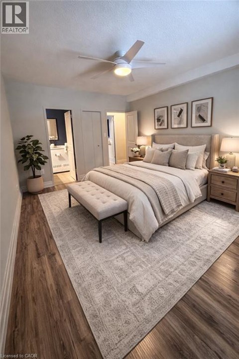 A bedroom with a large bed and a bench in the middle.