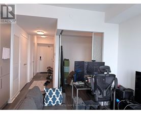 A room with a desk and a computer.
