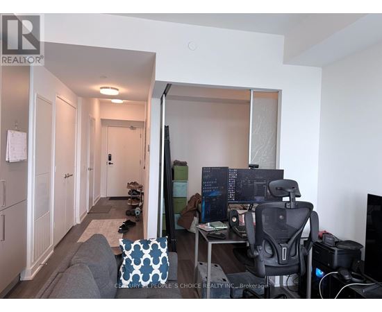 A room with a desk and a computer.