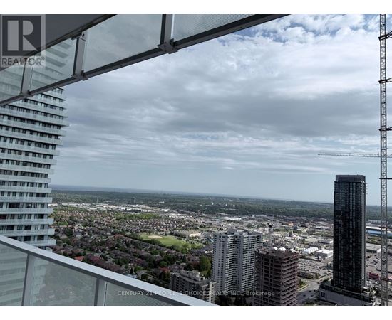A view from a high-rise building looking out over a cityscape.